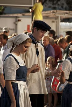 Day of German Unity,  festive parade, young couple in old fashioned clothes, photo taken in Bonn on the 3 of October 2011