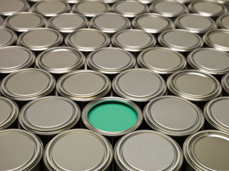 Full Frame of Paint Cans, one filled with Green paint