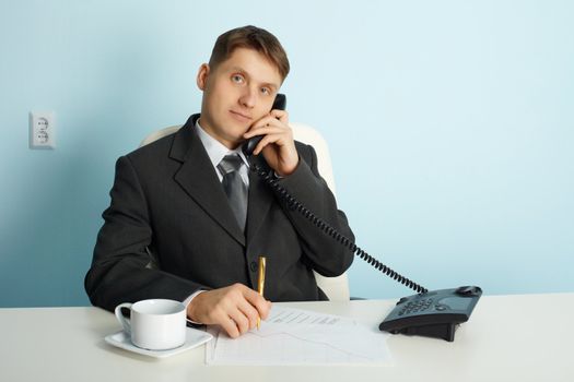 Ordinary official working in the office - talking on the phone