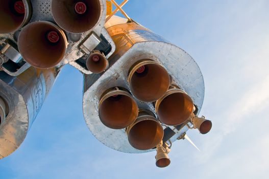 Nozzles space rocket Soyuz. Close-up on a background of clear blue sky.