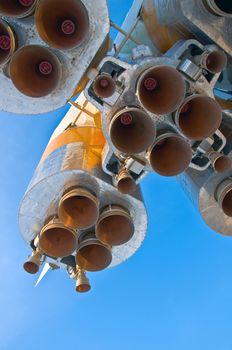 Nozzles space rocket Soyuz. Close-up on a background of clear blue sky.