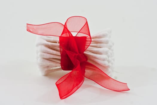 The top of cotton swabs with red bow
