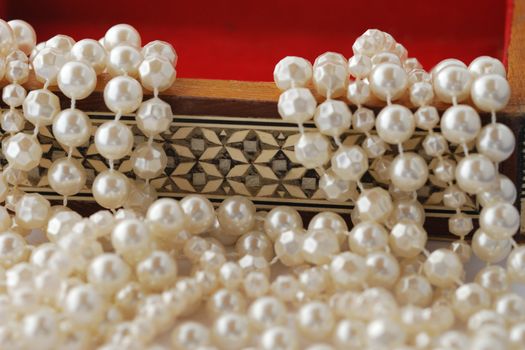 pearls flowing out of jewelry box