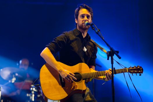 CANARY ISLANDS - SEPTEMBER 30: Guitarist and singer Victor Ordonez from the band The Good Company during Heineken Music Fest September 30, 2011 in Las Palmas, Canary Islands, Spain