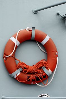 View of a red life saver buoy on a boat.