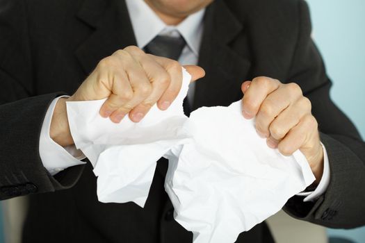 Businessman violently tormented the paper in his hands