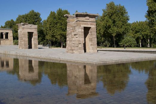 Egyptian temple in Madrid is reflected in the surrounding transparent water