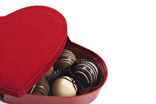a Red heart shaped box of chocolates on a white background with space for text