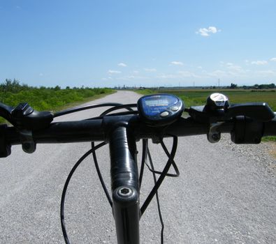 a countryside street view by a bycicle