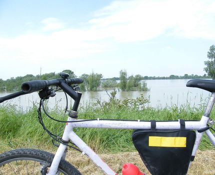 a bike near a river on a countryside street