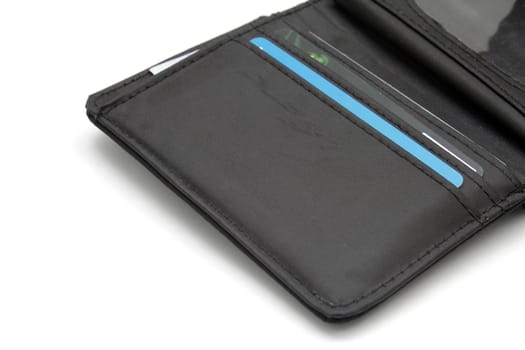 Opened black wallet with cards inside on white background