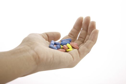 pills in hand isolated on white background
