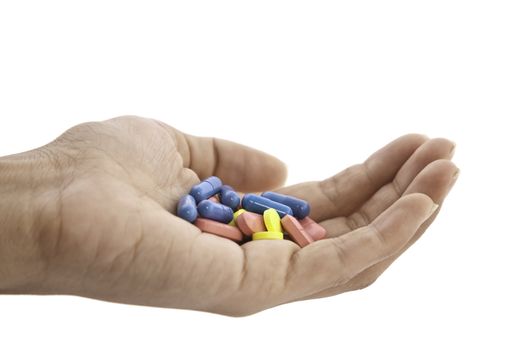 pills in hand isolated on white background