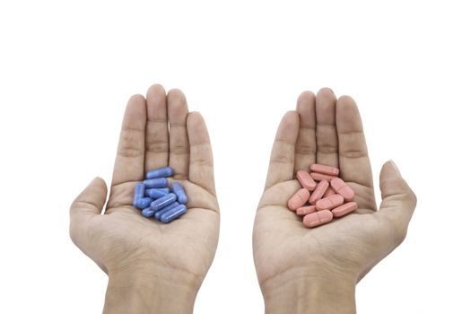 pills in hands isolated on white background