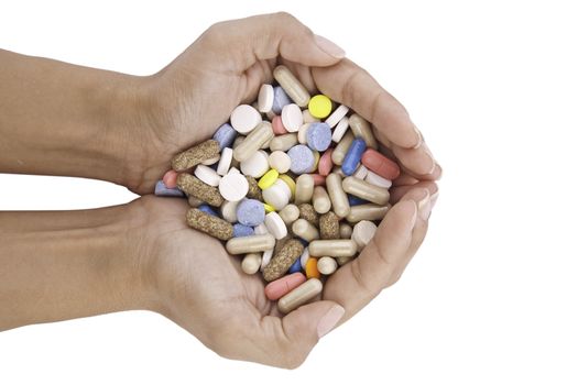 pills in hands isolated on white background