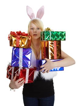Girl in fancy dress with lots of gifts on white