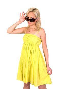 Girl in a yellow summer dress and sunglasses isolated on white background