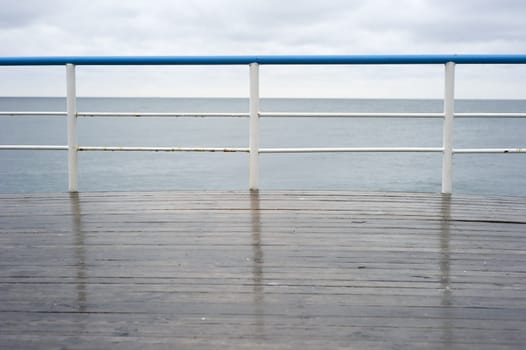 Handrail on a deck in the rainy day