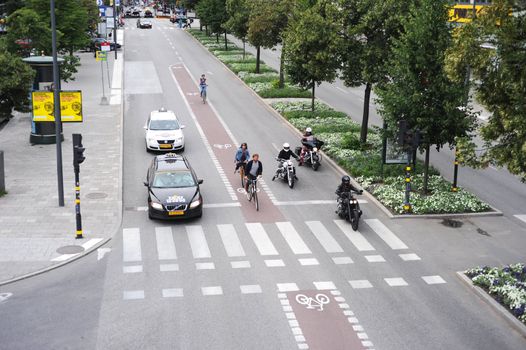 STOCKHOLM, SWEDEN - AUGUST 18: Special line for bicyles and scooters as a result of enormous amount of vehicles on the road on August 18, 2010 in Stockholm, Sweden