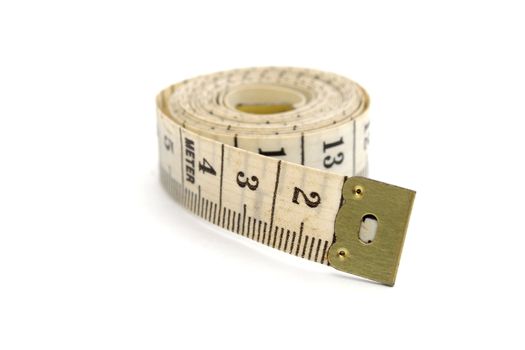 Rolled measuring tape isolated on white background
