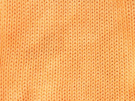 Closeup photo of the orange woolen clothe