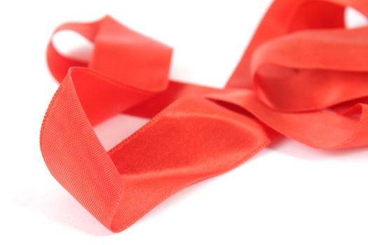 Bright red ribbon isolated on white background