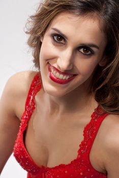 Happy girl in red shirt with a big smile showing her teeth