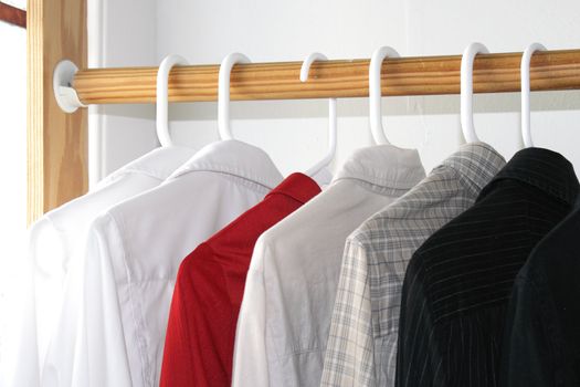 Shirts of different colors in the closet