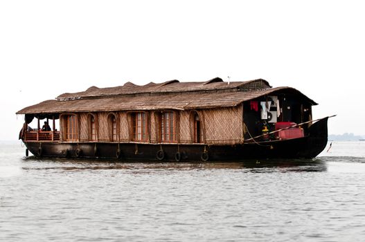 A houseboat cruises on the backwaters of Kerala, India