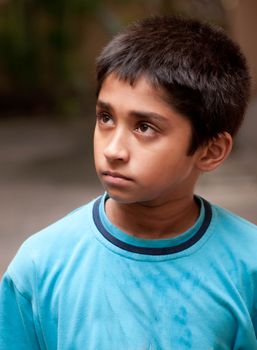 An handsome Indian kid looking very serious
