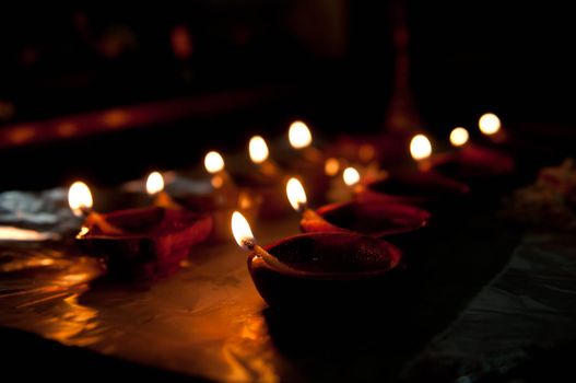 A mud lamp lit on the auspicious occasion of diwali