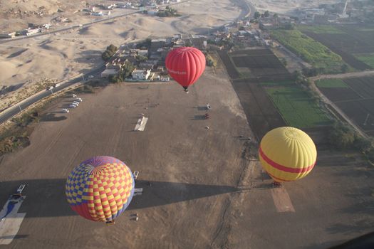 3 Hot air balloons Luxor Egypt, aerial shot from above