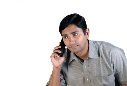 An handsome Indian businessman on call all the time