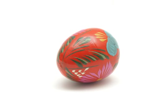 Wooden painted Easter egg isolated on white background