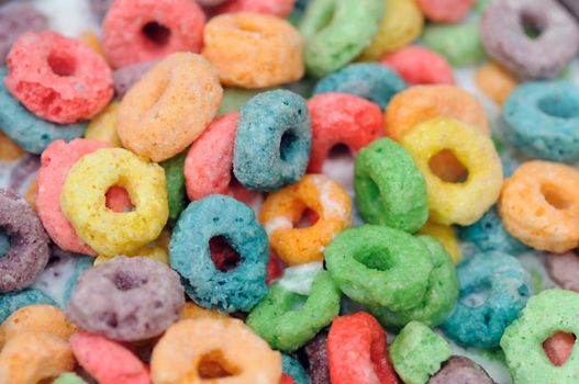 orange, blue, green and purple cereal fruits