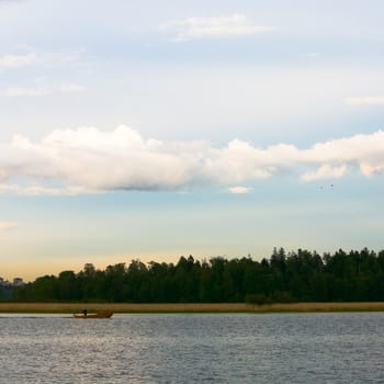 Boat sailing at sea in the evening.