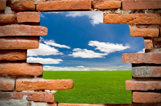 old brick wall in front of the blue sky