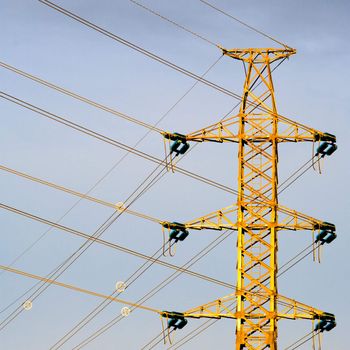 Electricity pylon against a hazy blue sky