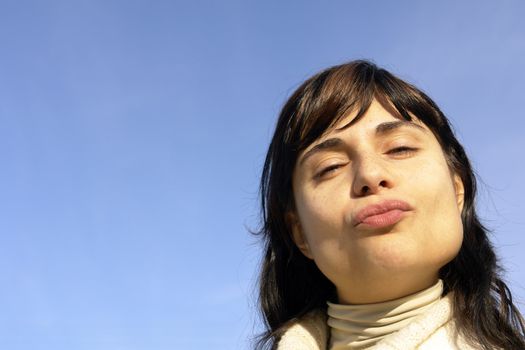 woman portrait with the sky as background