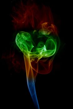 abstract colored smoke in a black background