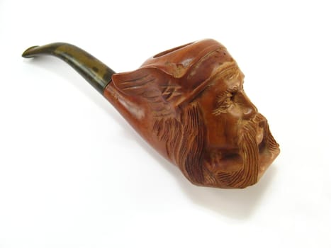 a sculptured pipe with a gaul man's head