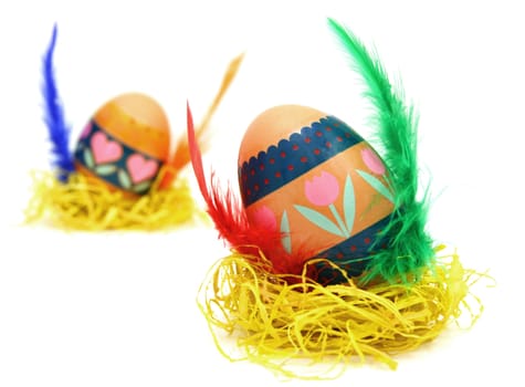 Easter egg race. Wings made of color feathers. Isolated on white.