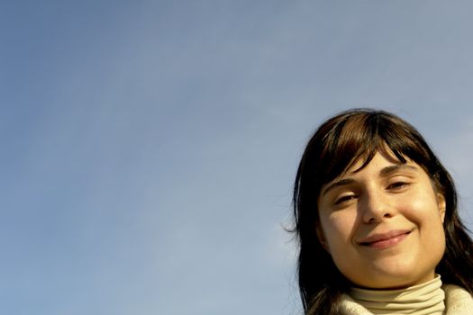 young woman close up portrait enjoying the sun