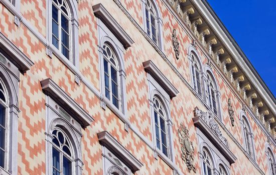 Front of an historical building in a sunny day agaist a blue sky