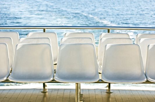 White seats on a tourist boat