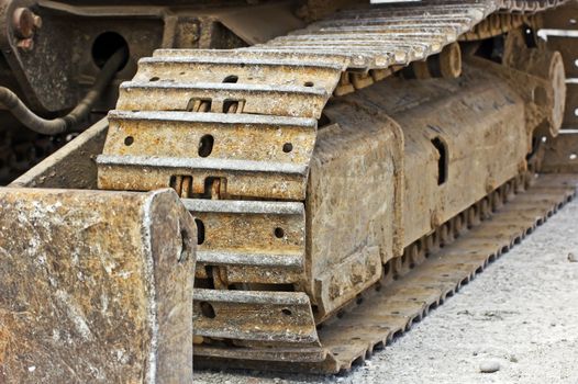 Close-up of a rusty tracked wheel