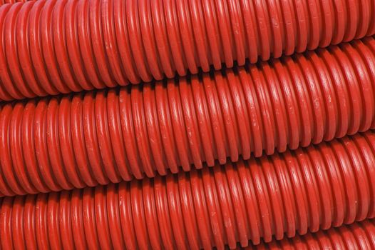 Close-up of red plastic pipes