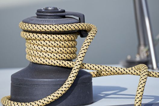 Rope rolled up on a winch in a sailboat