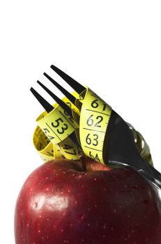 apple, autumn, centimeter, centimetre, crutch, cutlery, diet, drew, drop, eat, fall, fork, fruit, loose, measure, prong, red, vitamin, water, weight, yellow, 