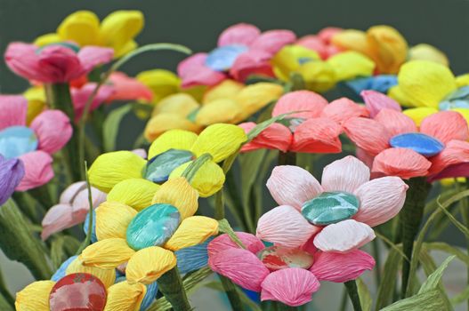 Many coloured handmade flowers made with crepe paper